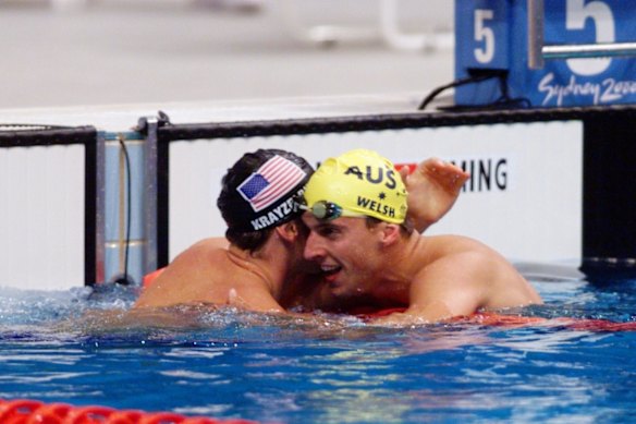 Matt Welsh getting a hug from Lenny Krayzelburg from the USA after the 100m backstroke final.