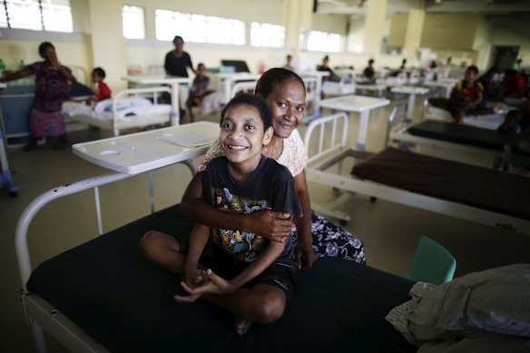 13-year-old Sylvester Begama with his mother Theresa Nata. Sylvester was admitted to the Port Moresby General Hospital 1 year and 10 months ago for tuberculosis and severe malnutrion. His treatment has been considered a success and he is due to be discharged in a week. 