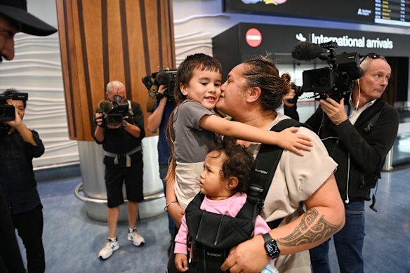 Lisa Te Tai and her granddaughter Manaia Taalili arrive in Auckland to be greeted by her son Marcelle Te Tai and his son.