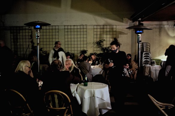 People enjoying the first hour of restaurants re-opening at the The Supper Club in Melbourne at midnight