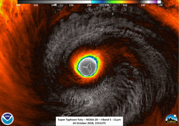 This false-colour satellite image provided by the National Oceanic and Atmospheric Administration shows the moment the eye of Super Typhoon Yutu passed over Tinian, one of three main islands in the US Commonwealth of the Northern Mariana Islands.