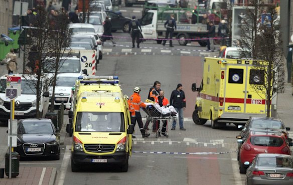 A victim is taken Maalbeek station after the train blast.