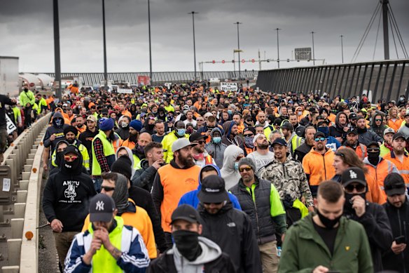 Hundreds of protesters march over the Westgate Bridge in Melbourne. 
