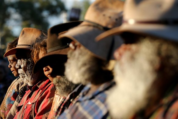 Mutitjulu elders watching performers from Muakgau Lak Gubau Gizu (Thursday Island) during the opening ceremony of the First Nations National Convention held in Uluru, at the Mutitjulu community.