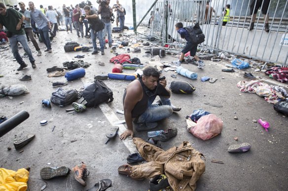 A refugee protester is left dazed after police responded with force against a large group on the Serbian-Hungarian border.