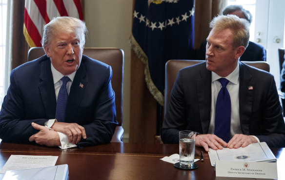 Patrick Shanahan listens as President Donald Trump speaks during a cabinet meeting at the White House in April. 