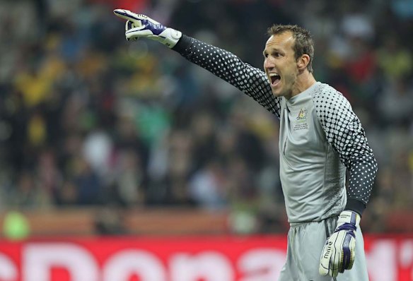  Mark Schwarzer of Australia directs his defence during the 2010 FIFA World Cup South Africa Group D match between Australia and Serbia.
