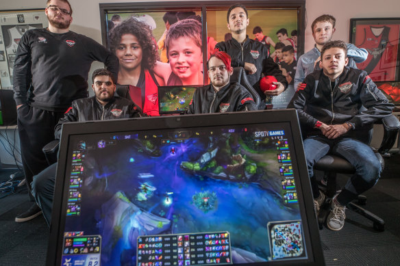 The Bombers eSports team, owned by the Essendon Bombers AFL team. Carlo La Civita (back row, second from left), says the investment has helped a lot.