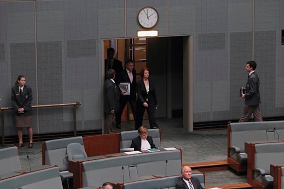 Prime Minister Julia Gillard enters Parliament for her first question time as Prime Minister.