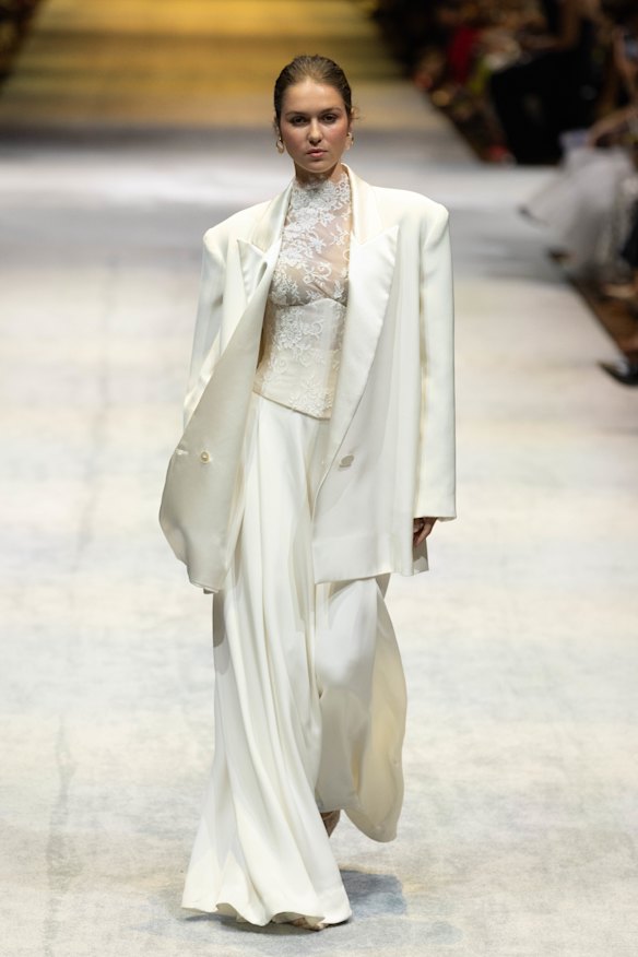 A model in a bridal suit designed by Sonia Cappellazzo and shown on the runway at Melbourne Fashion Festival in February.