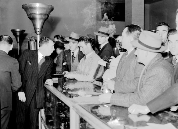 Shoppers crowd the tobacco counter at David Jones' Market Street store on August 5, 1946. 