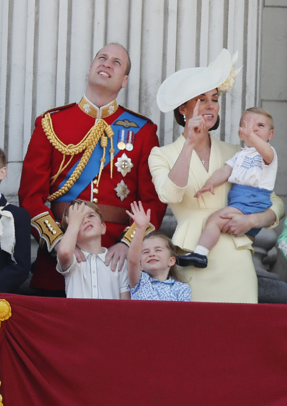 Prince William and Kate with their children.