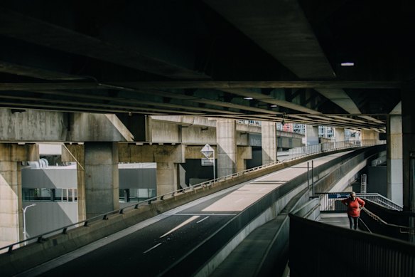 Ultimo underpass, Sydney. March 25, 2020.

“The cars coming down the Western Distributor usually make this strip of road deafening, the sounds buffeting off the overpass above. When I took this photo, I could hear the lady’s footsteps, her panting as she walked up the incline. Sydney has gone quiet, you can hear everything and nothing." – Roger Stonehouse, a photographer for The Sydney Morning Herald, who moved to Sydney in 2015.
