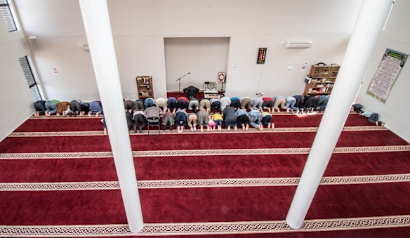 Men take part in the early afternoon prayer at Gungahlin Mosque on Saturday.