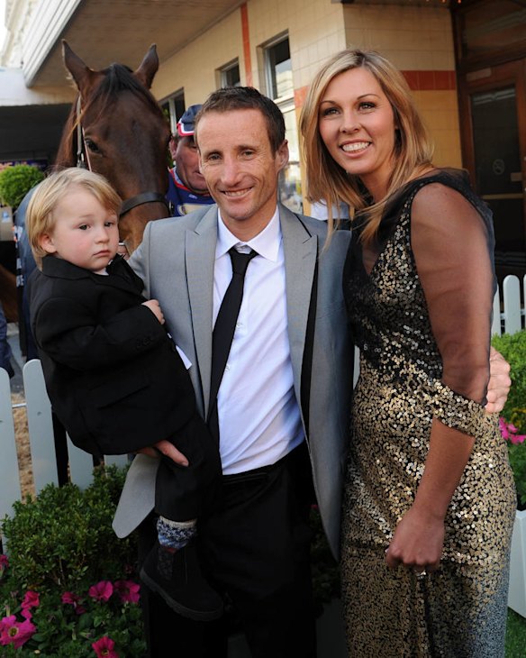 Damien Oliver with his wife Trish and son Luke at the premiere of The Cup in 2011.