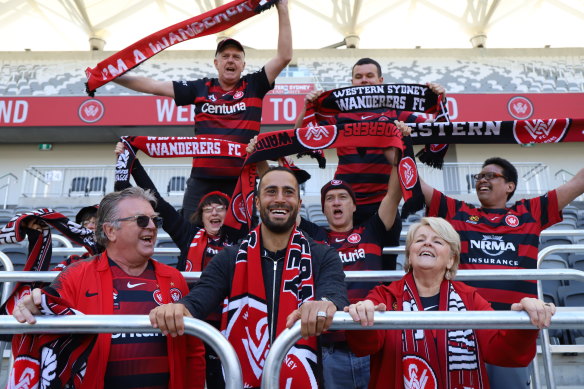 The new standard: Western Sydney defender Tarek Elrich with fans on Wednesday testing out the new safe standing areas at Bankwest Stadium.