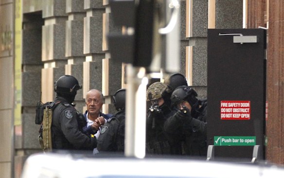 Hostage runs from Lindt cafe.