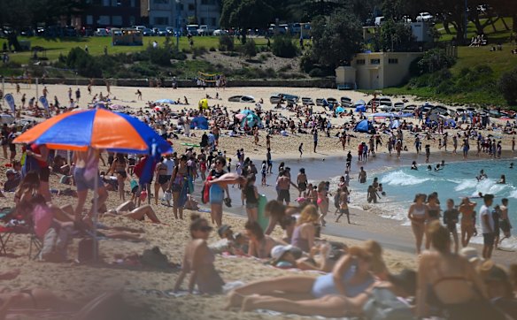 Beachgoers were trying to keep distance but no facemasks were seen.