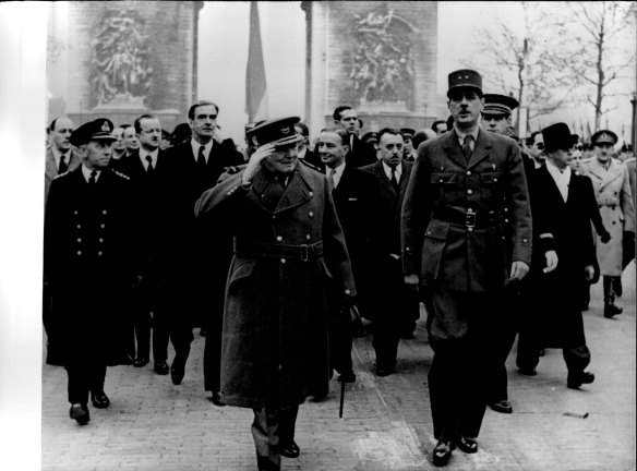 Winston Churchill and Charles De Gaulle walk down the Champs-Élysées after the liberation of Paris in 1944.