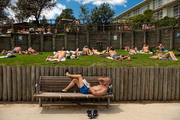 A patch of warm weather in late October draws locals to the beach at Bondi.