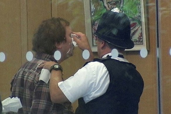 Jonnie Marbles has his face cleaned after he attacked Rupert Murdoch.