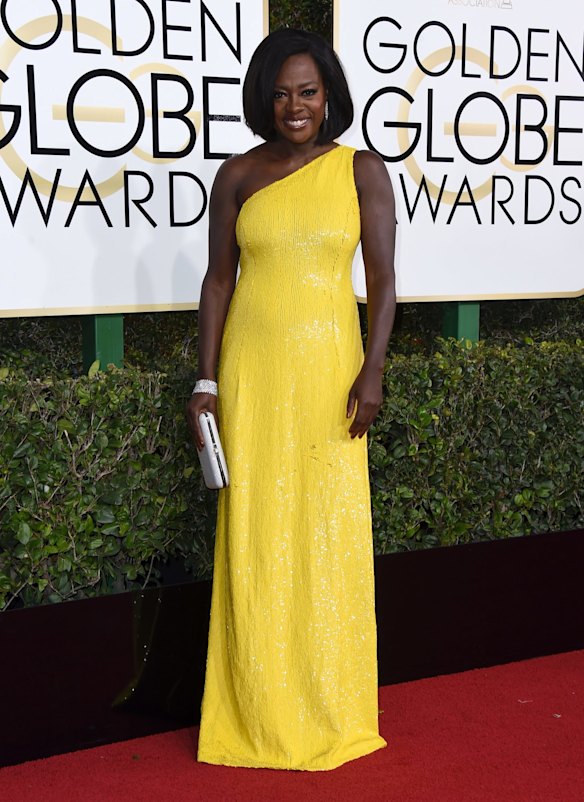 Viola Davis in a yellow one-shoulder gown.