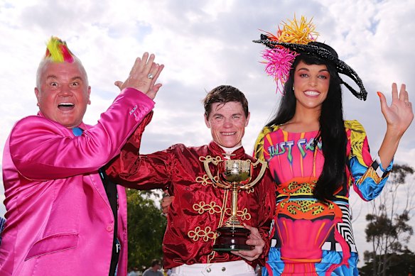 City of Greater Geelong Mayor, Cr Darryn Lyons (L) and his fiancee Elissa Friday pose with Craig Williams (C) after he won on Caravan Rolls On in race 7 the Sportingbet Powered By William Hill Geelong Cup, the fifth time he has won the race, during Geelong Cup Day at  on October 22, 2014 in Geelong, Australia. 