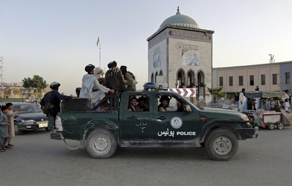 Taliban fighters patrol inside the city of Kandahar, southwest Afghanistan.