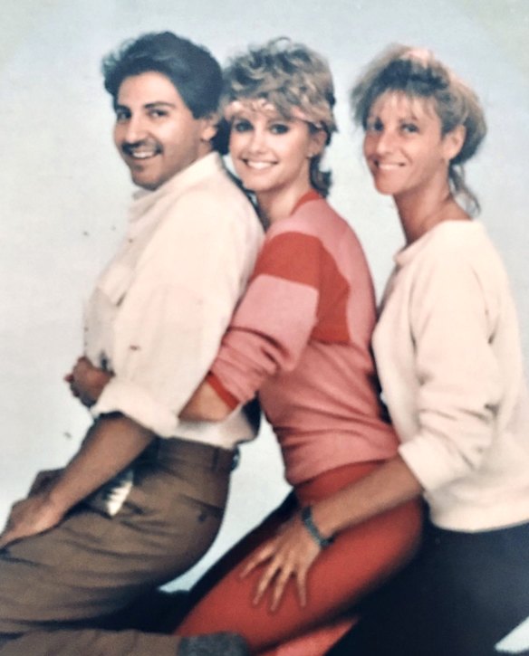 Olivia Newton-John (centre) with costume designer Fleur Thiemeyer (right) on the set of the 'Physical' music video shoot in 1981.