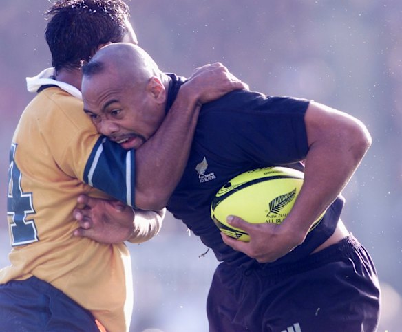 August 2001. Andrew Walker takes on Jonah Lomu during action from the 1st half of the Bledisloe Cup between Australia and the All Blacks at Carisbrook in Dunedin.