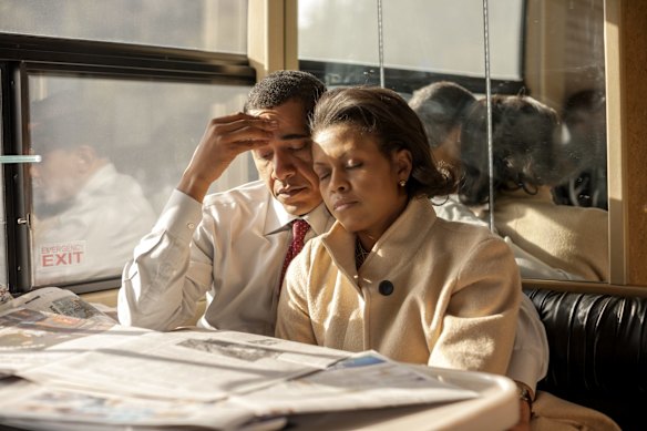 On primary morning in New Hampshire in January 2008, the Obamas find a rare moment of quiet together on an election bus after campaigning separately all week. 