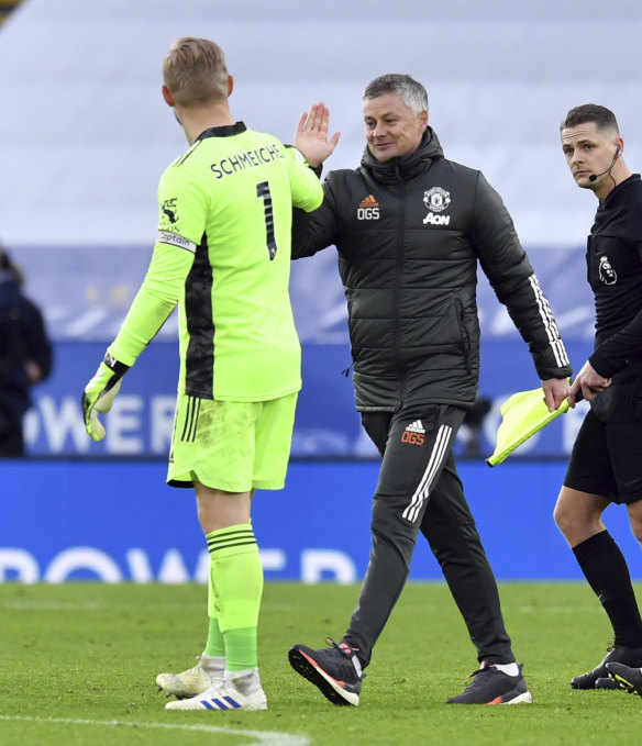 Leicester City goalkeeper Kasper Schmeichel greets Manchester United manager Ole Gunnar Solskjaer following the match.