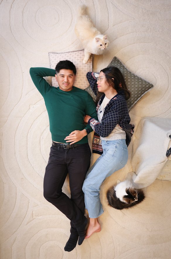 Eddie Kok and partner Joyce Lau, with cats Cloud (black and white) and Jasper.