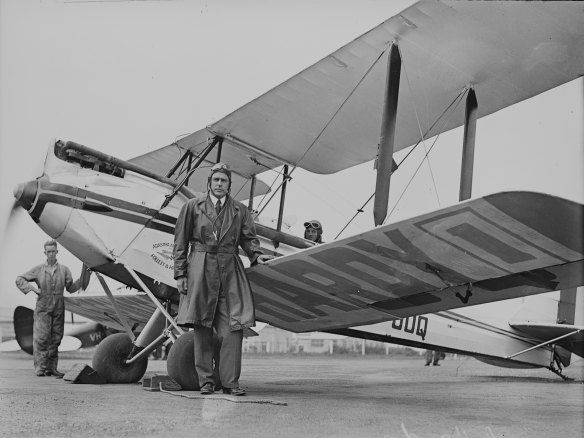 Politician Charles Hardy standing next his plane before departing on an aerial election tour, NSW, December 2, 1931. 