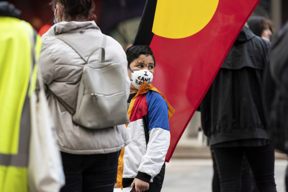 The last words of George Floyd, "I can't breathe" were written on face masks and placards.