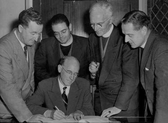 Members of the NSW Council of Churches sign a petition condemning new poker machine legislation on August 7, 1956.