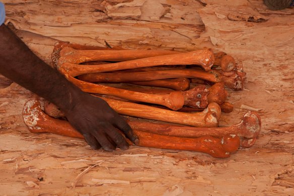July 19th 2011, step 2 is to cover the bones in red ochre  ,as human bones are finally reurned to their ancestral home in Gunbalanya for ceremonial reburial after over 60 years in the posession of the Smithsonian Institution after being collected during a combined Australian and American expedition to Arnhem Land in 1948.