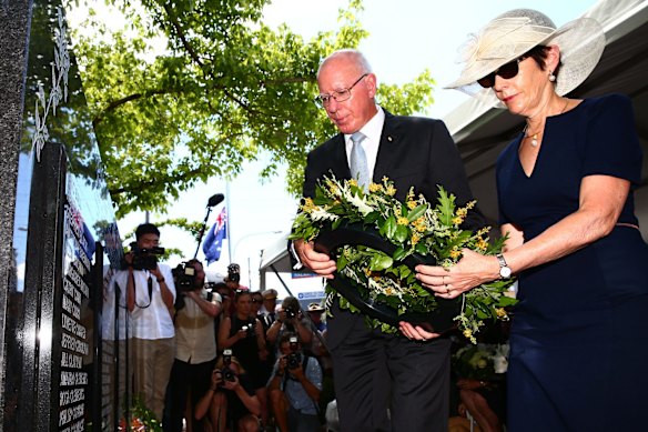 Governor General David Hurley and his wife lay a wreath.