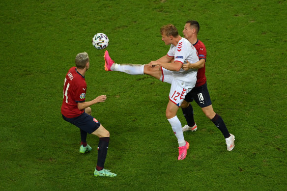 Kasper Dolberg of Denmark controls the ball whilst under pressure from Jan Boril.