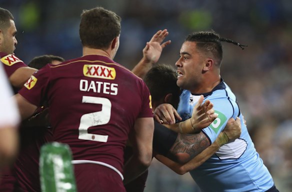 Andrew Fifita of the Blues clashes with Maroons player.