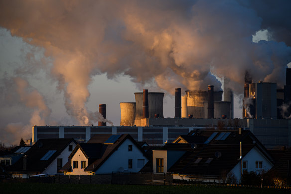 Steam rises from cooling towers at the Niederaussem coal-fired power plant in Germany. The electricity sector has low-carbon alternatives but other sectors are so far lagging.