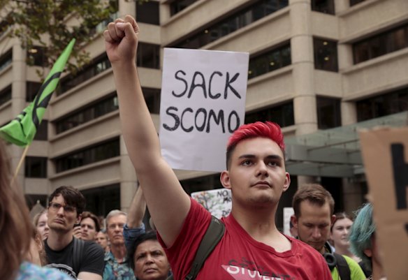 Thousands gather at Town Hall in Sydney CBD to demand action on climate change and the deposition of Prime Minister Scott Morrison.