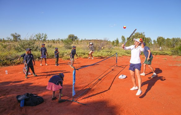 Barty plays tennis with Mutitjulu school students in Uluru-Kata Tjuta National Park, Northern Territory,  in February.