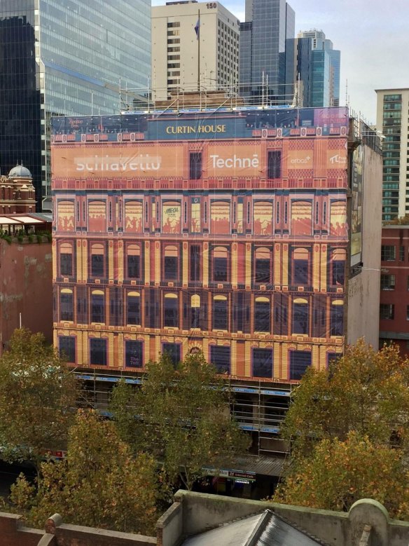 Curtin House in Swanston Street has given itself a pretty hoarding after The Age complained about ugly ones around Melbourne. 