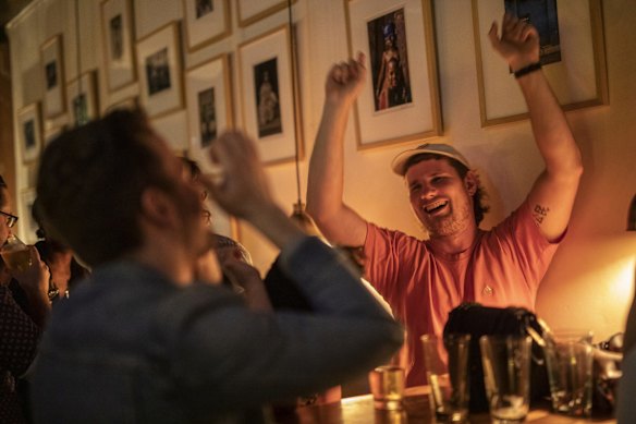 Patrons at Bitter Phew in Darlinghurst, enjoy the intimate atmoshphere to share a drink and a chat on the first night of no lockout laws.