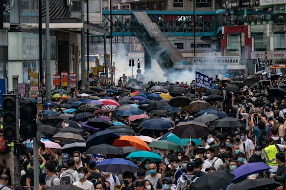Police fire tear gas to disperse protesters during an anti-government rally in Hong Kong, China. 