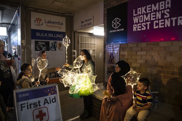 Sahar and her three-year-old son Maaz (sitting) are visiting from Canberra.