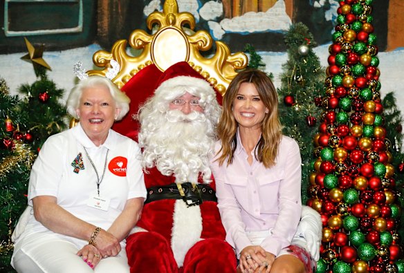 Variety Kids Xmas Party is organised by the Ladies of Variety, one of whom is Elizabeth Higlett, mum to Channel Nine's Amber Sherlock. Pictured here with Santa Claus.