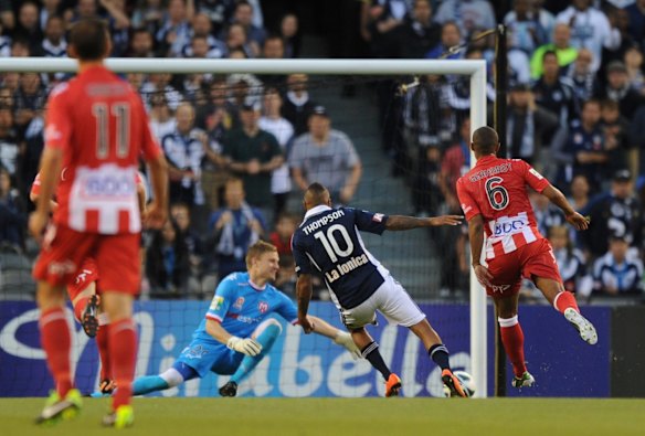 Derby deed: The Heart's Andrew Redmayne can't stop Archie at Etihad Stadium.