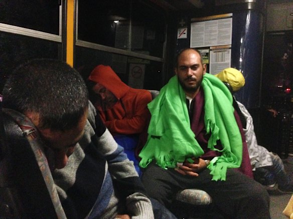 Migrants board buses said to be bound for Austria outside Keleti station in central Budapest, Hungary.
